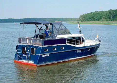 Aft view with rain cover of the houseboat Carlotta from Berlin boat rental