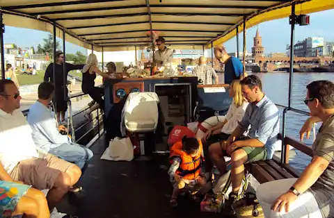 Interior of the Hopper boat on a boat tour of Berlin with guests on board