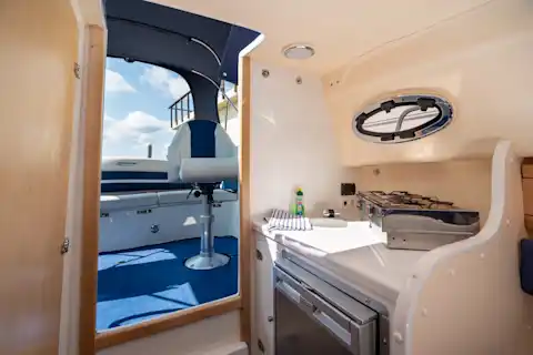 Salon of the motor boat Mia with fridge 