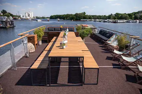 Upper deck with tables and chairs on our party boat 